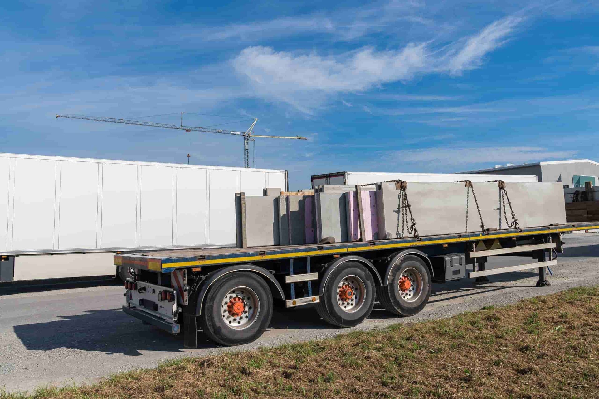 A Semi Truck is Carrying Concrete Blocks on a Flatbed Trailer — Ballarat Supatilt in Warrnambool, VIC