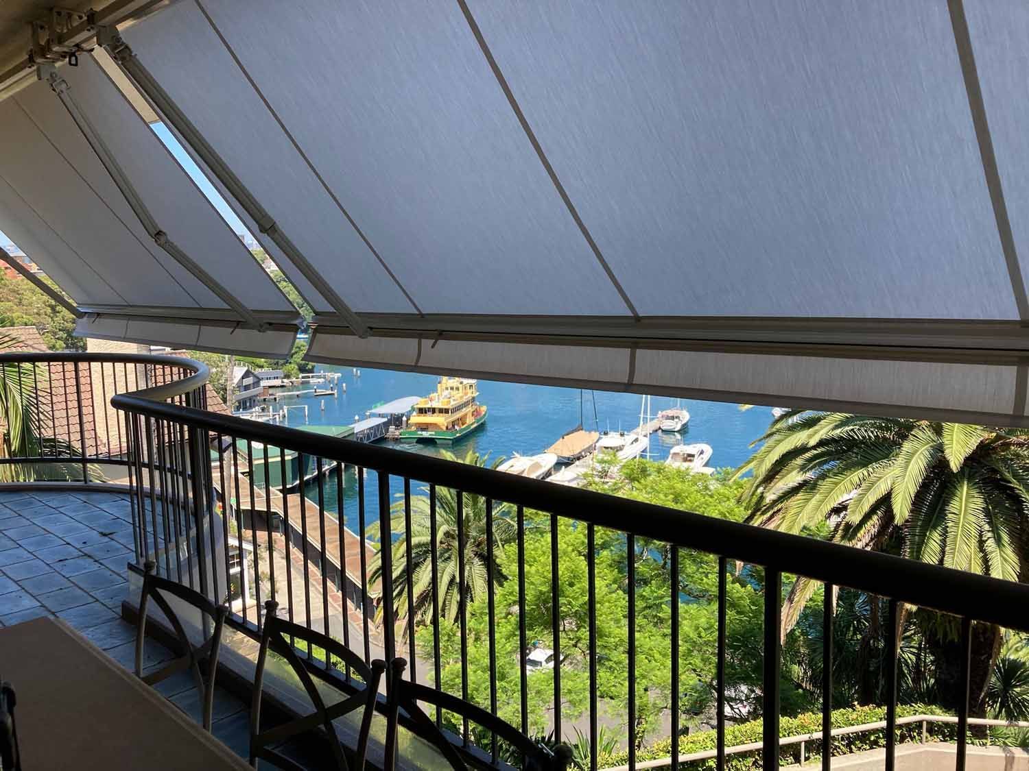A balcony with a view of water and boats | Sydney, NSW | Sunmaster Australia