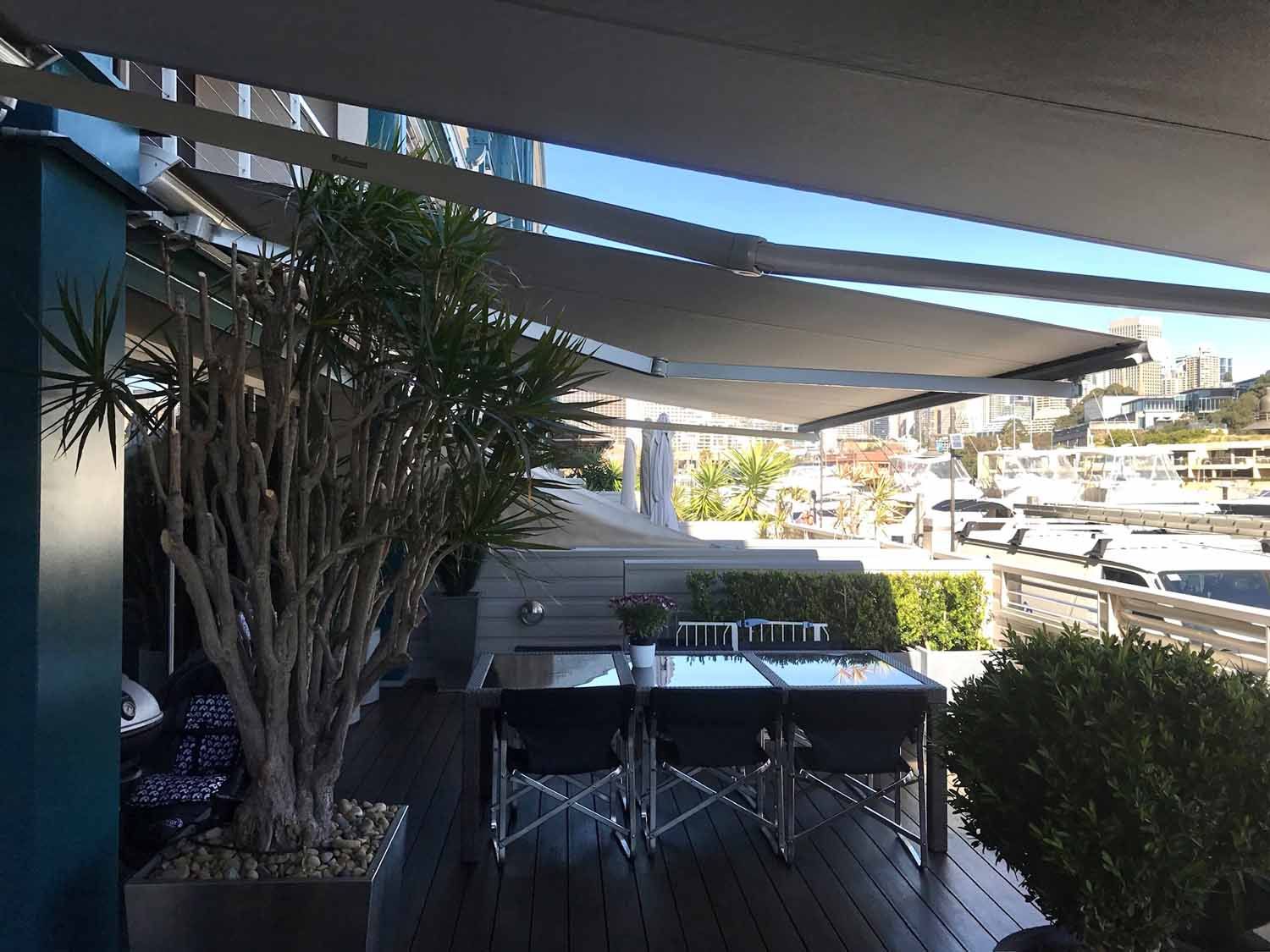 A table and chairs on a deck | Sydney, NSW | Sunmaster Australia