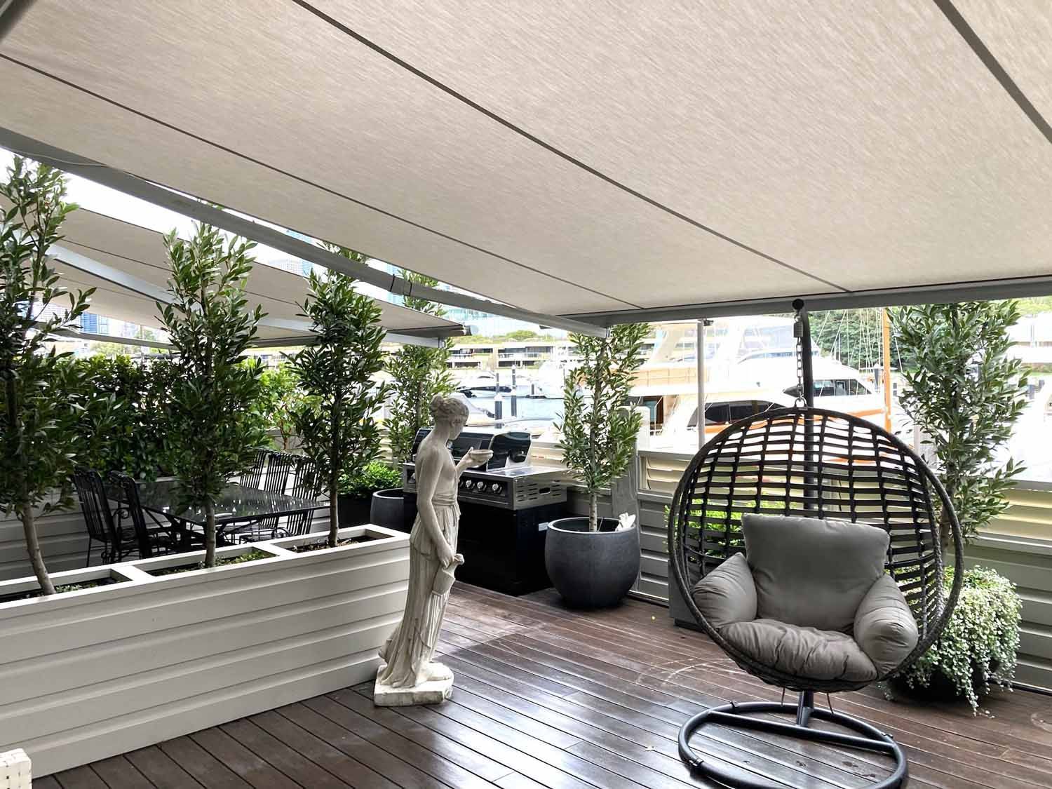 A patio with a chair and a statue | Sydney, NSW | Sunmaster Australia