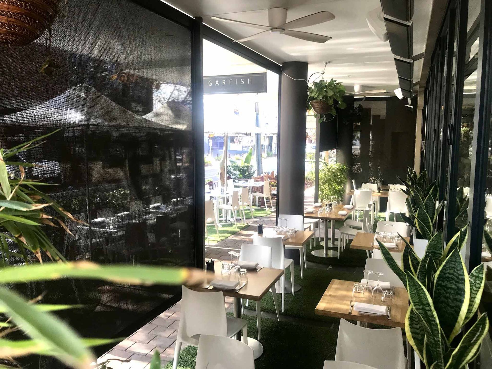 A restaurant with tables and chairs | Sydney, NSW | Sunmaster Australia