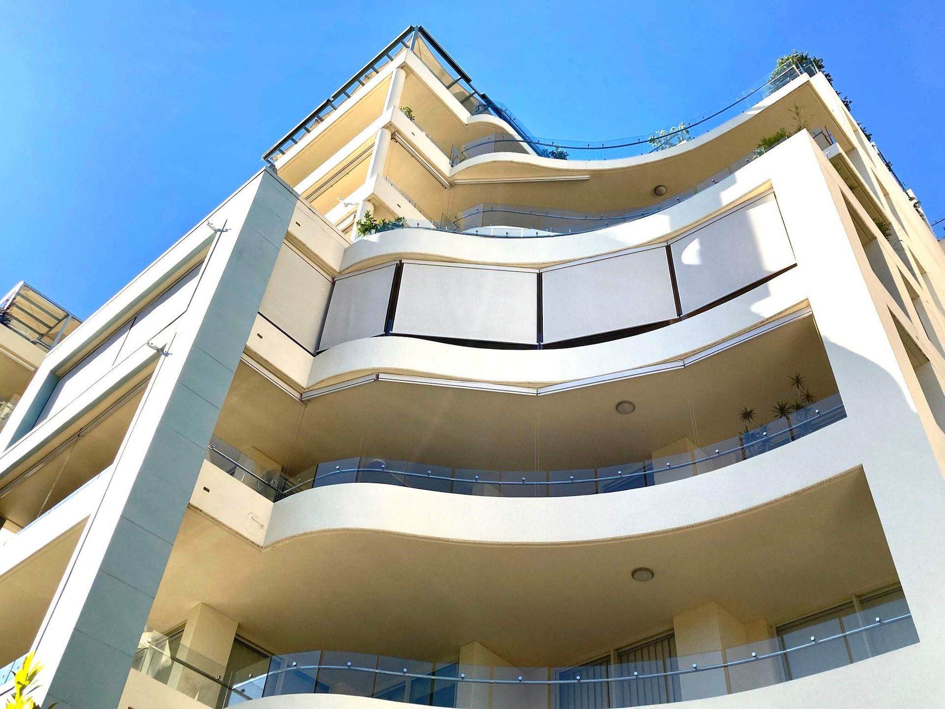 A yellow building with balconies | Sydney, NSW | Sunmaster Australia