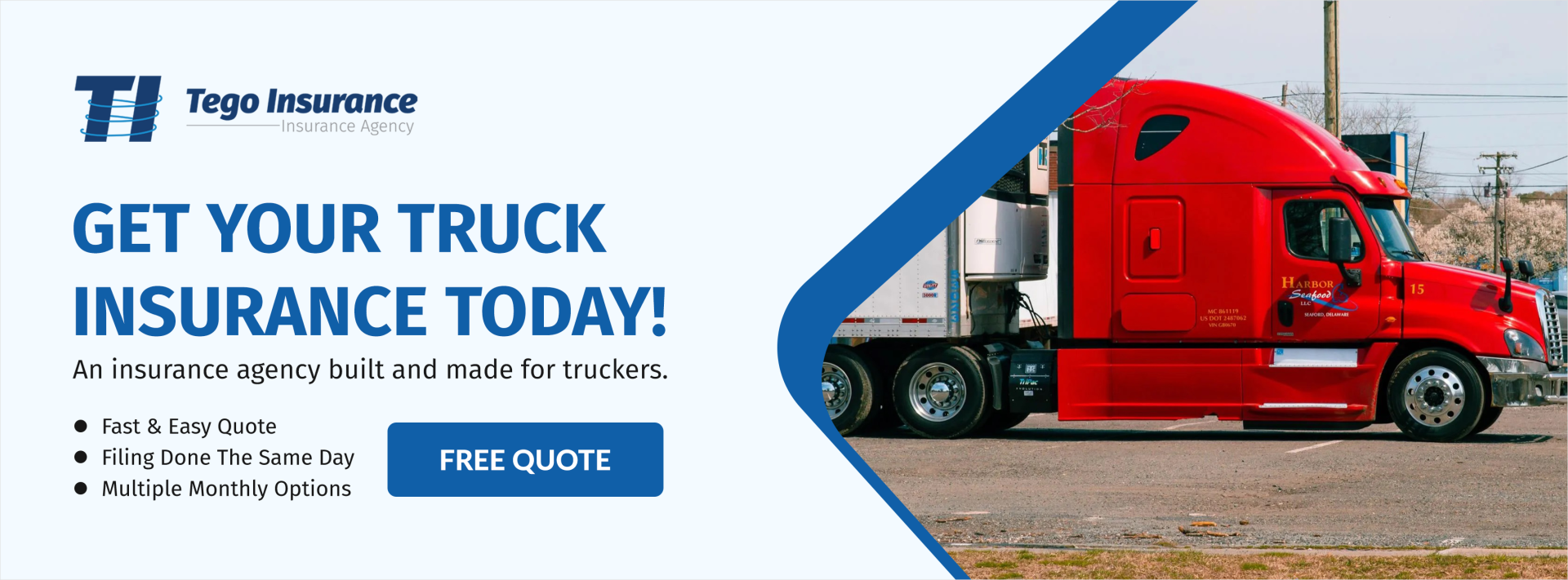 A red semi truck is driving down a road.