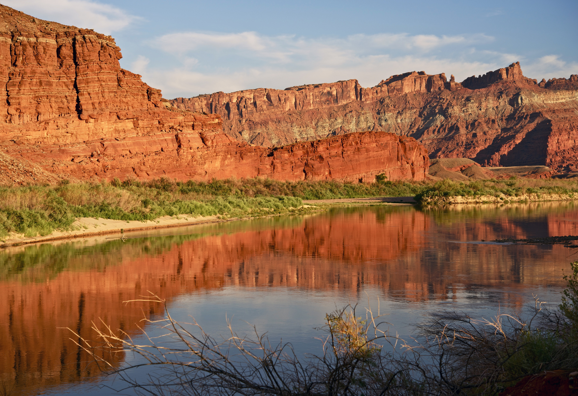 a large body of water with mountains in the background