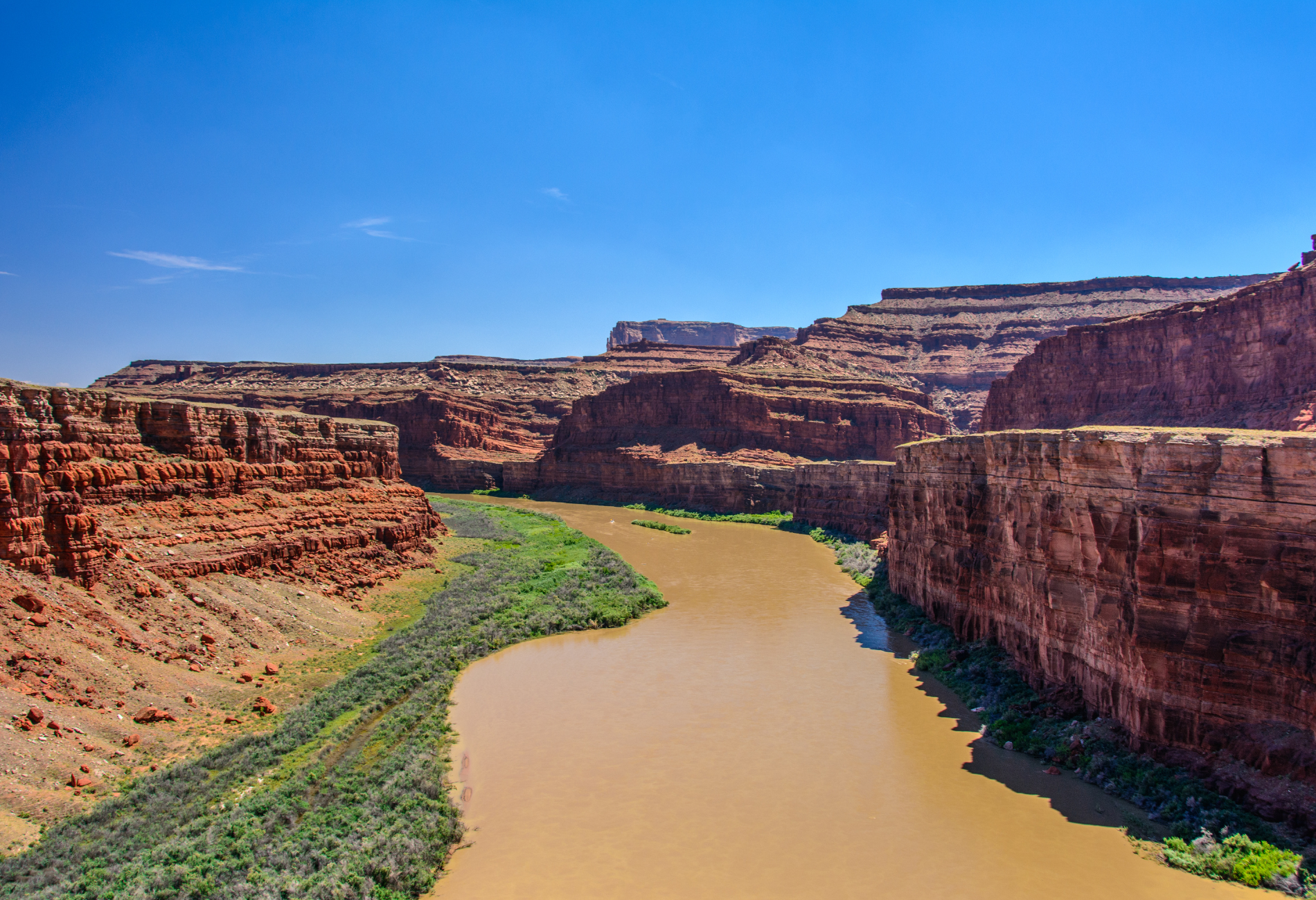 a river runs through a canyon surrounded by rocks .