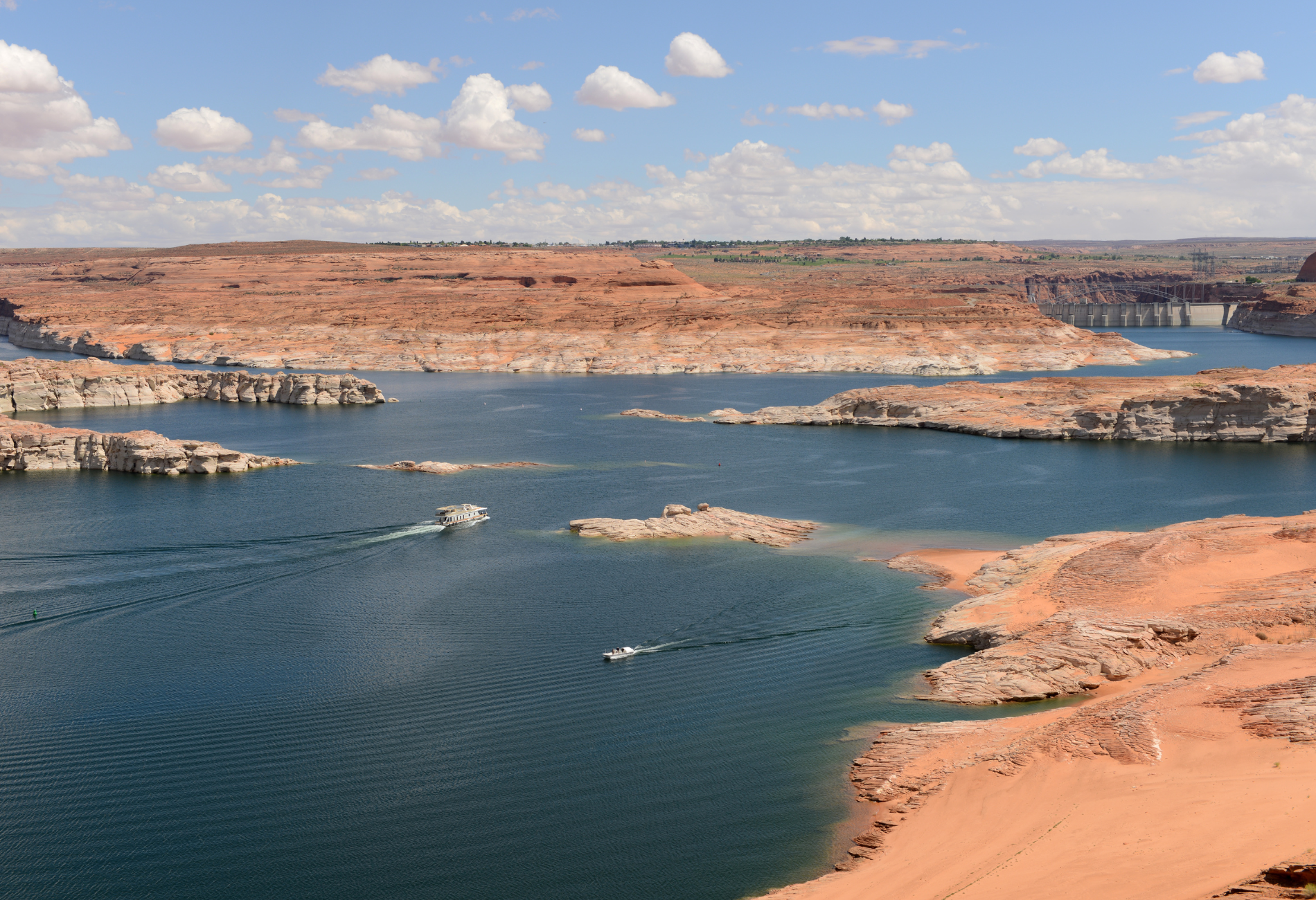 a large body of water with a bridge in the background