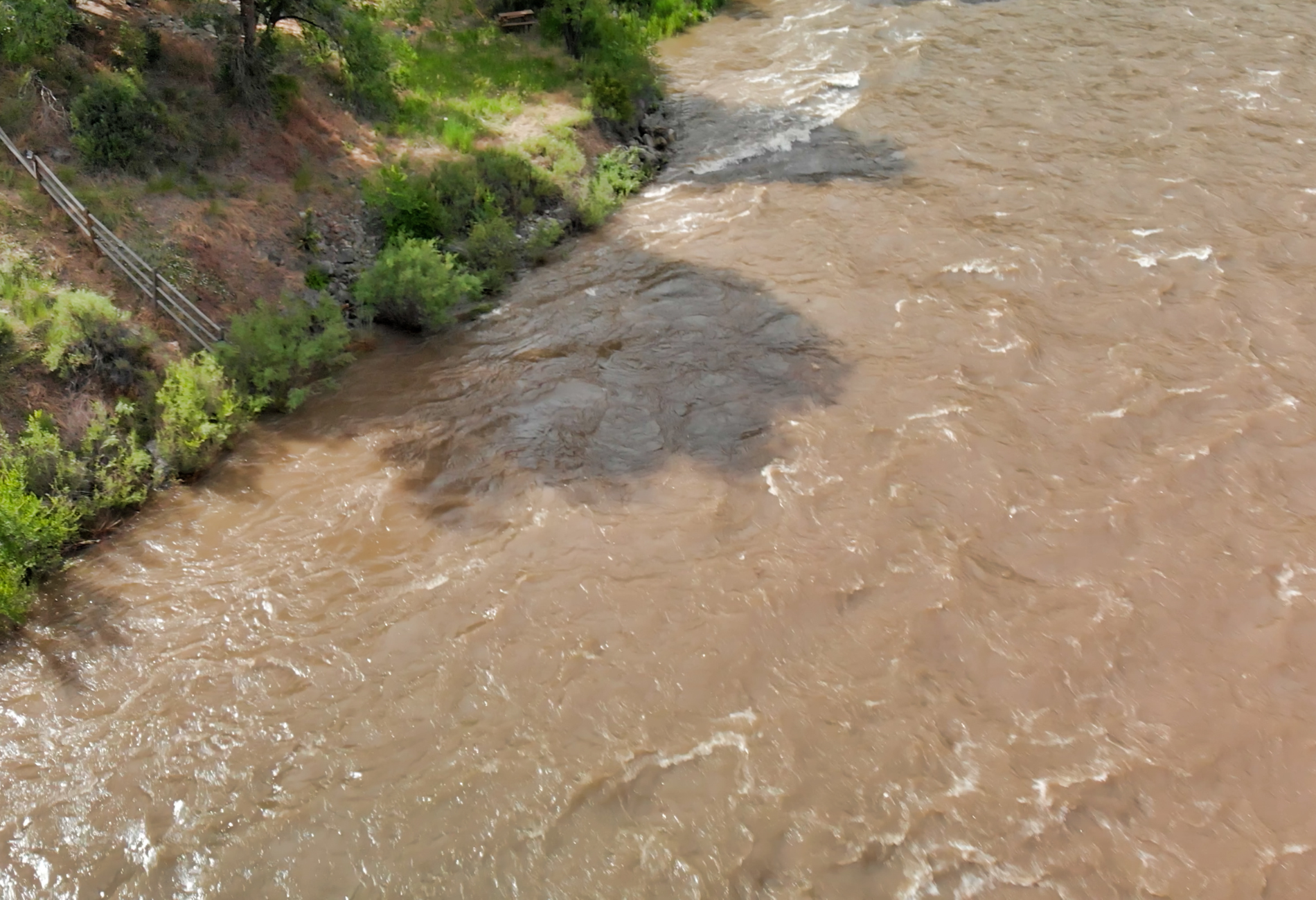 a river with a lot of water and trees on the side of it .