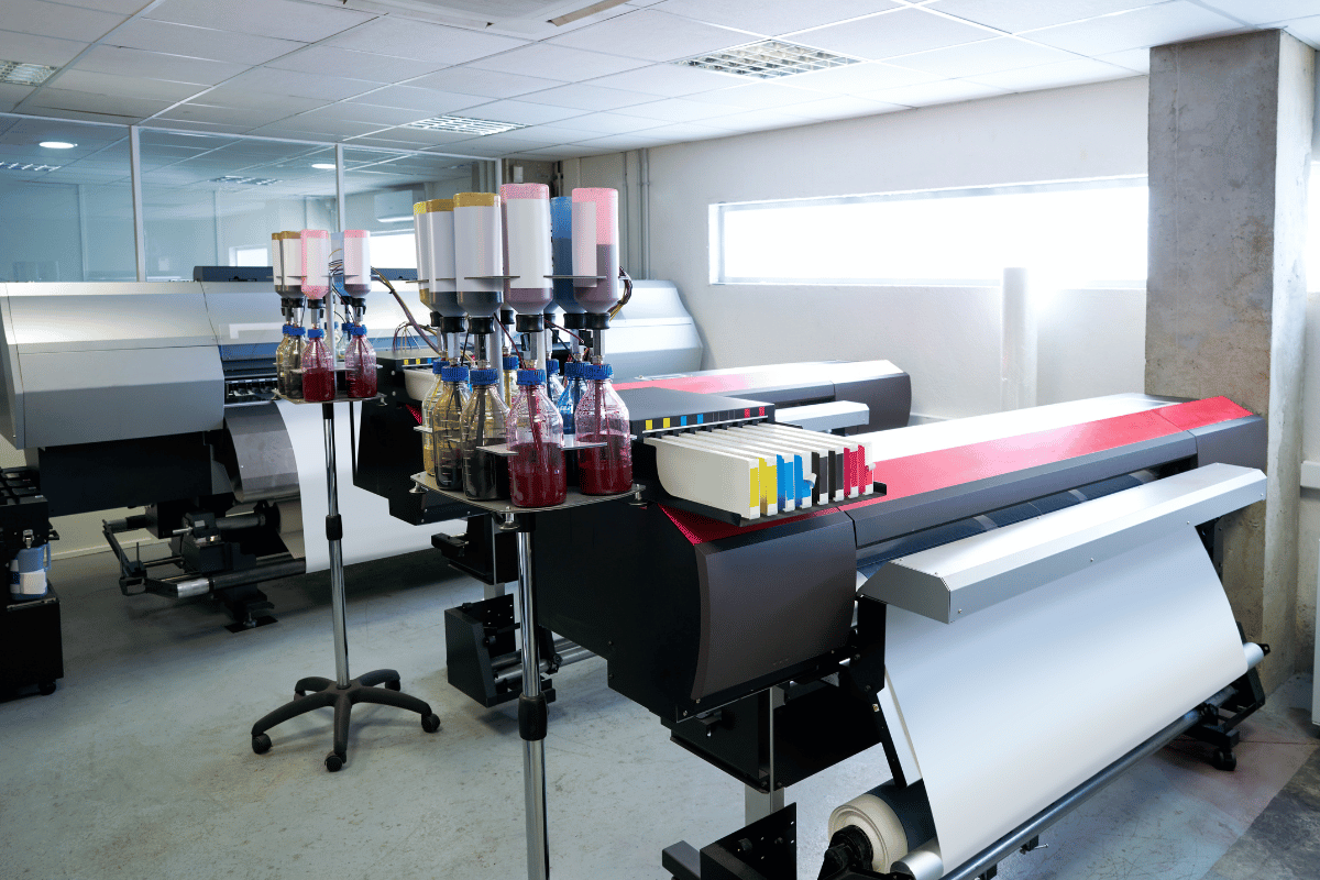 White built-in closet system in a room with dark purple walls and gray carpet.