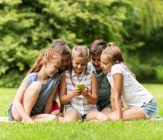Childcare — Children Using A Smartphone in San Antonio, TX