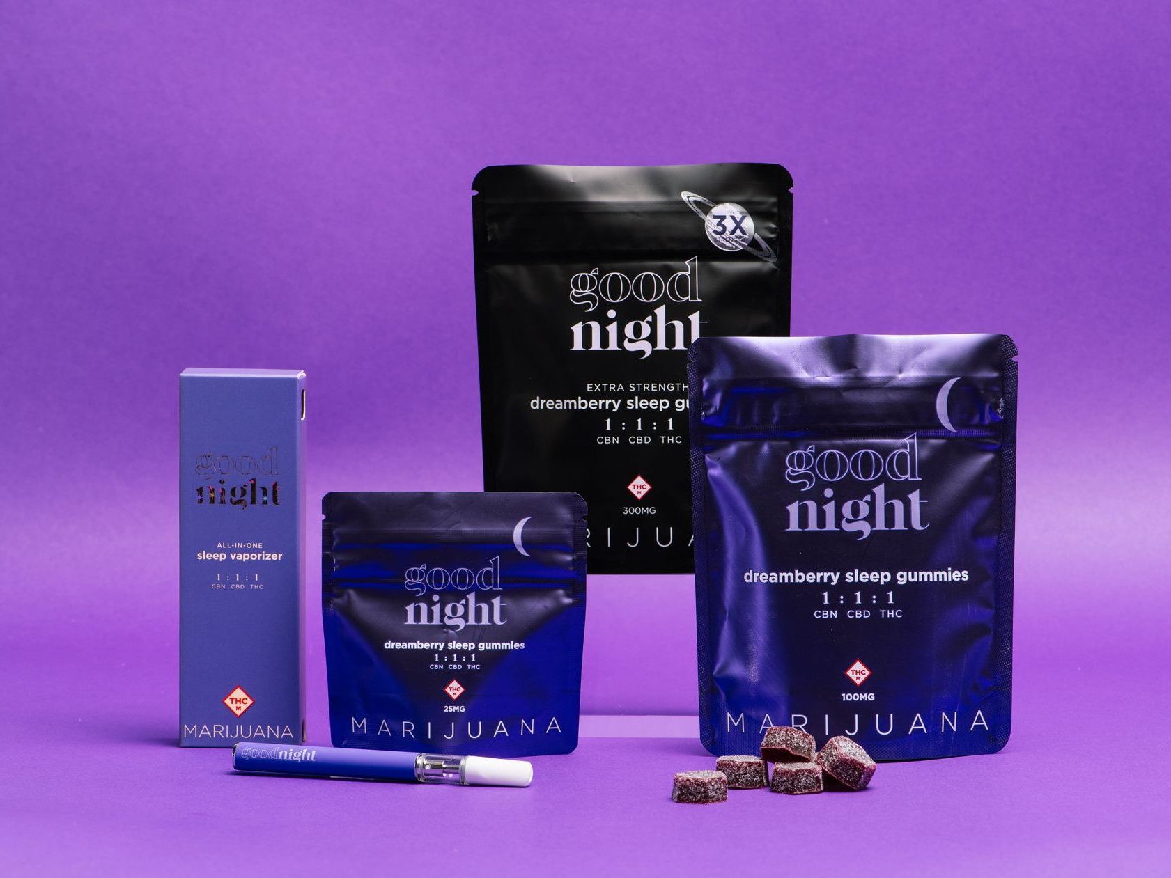 A group of Goodnight products are sitting on top of a purple backdrop.