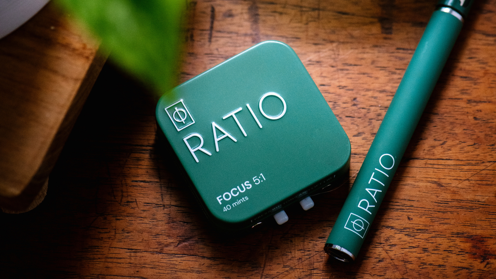 Green RATIO focus mints and vape on wood background