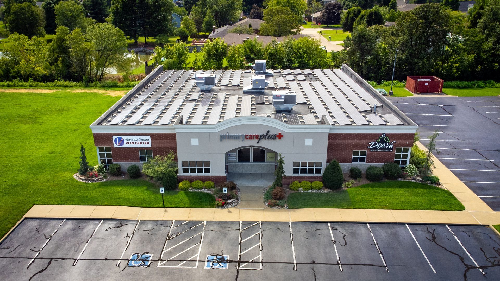 an aerial view of a building that says primary care plus