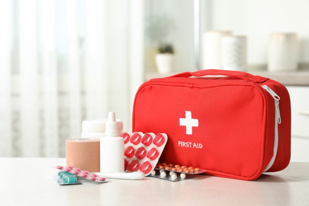 First Aid Kit With Pills On Table — First Aid Industrial Medical In Taree, NSW