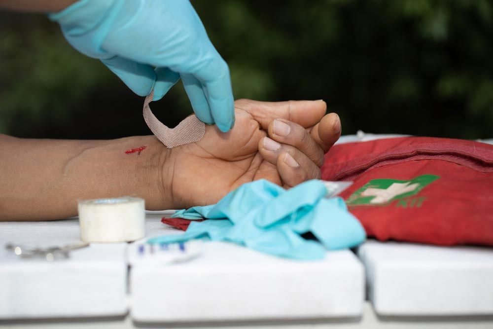 Applying First Aid Plaster — First Aid Industrial Medical In Newcastle, NSW