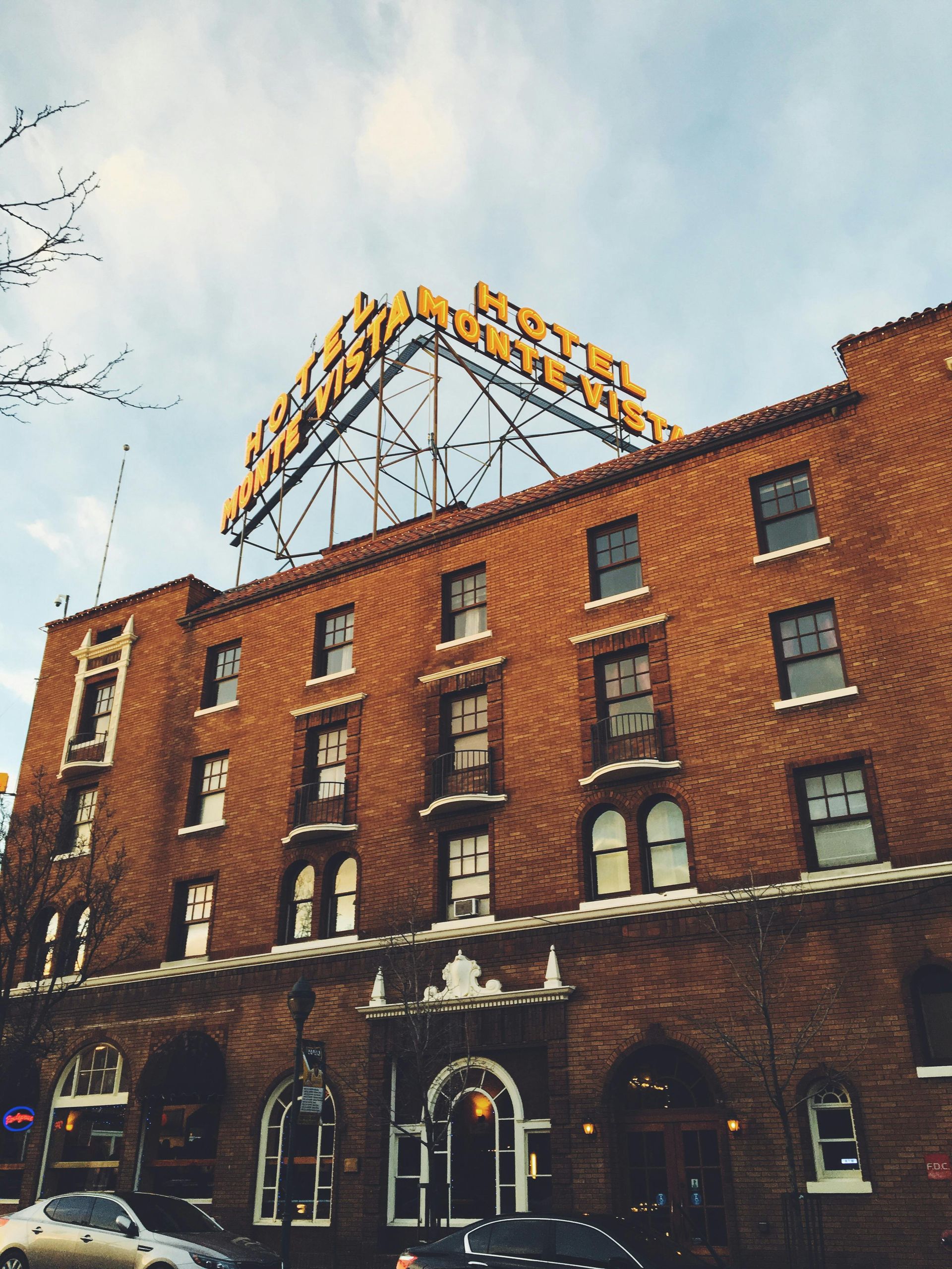 Split image of a suburban Mesa East Valley home and a Prescott mountain property — Bonelli Financial Group Arizona real estate analysis.