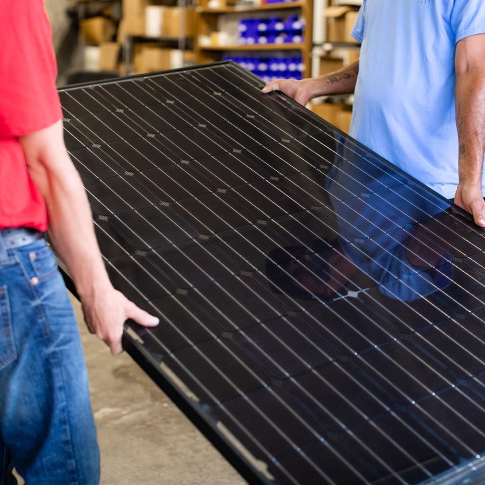 Staffs Carrying Solar Panel — Lutz, FL — Coast to Coast Solar Inc.