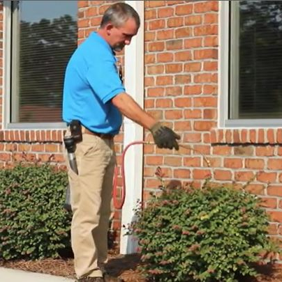 Exterminator in Work Spraying Pesticide — Wilmington, NC — Canady & Son Exterminating Inc
