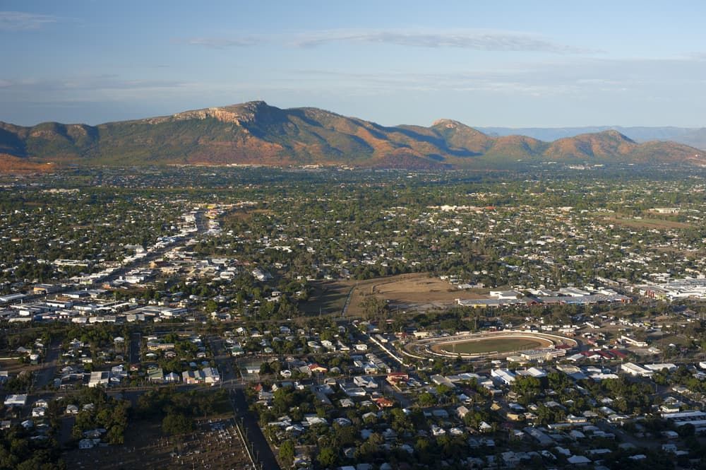 An Aerial View of a City With Mountains in the Background — Calibre Resourcing Solutions in Townsville, QLD