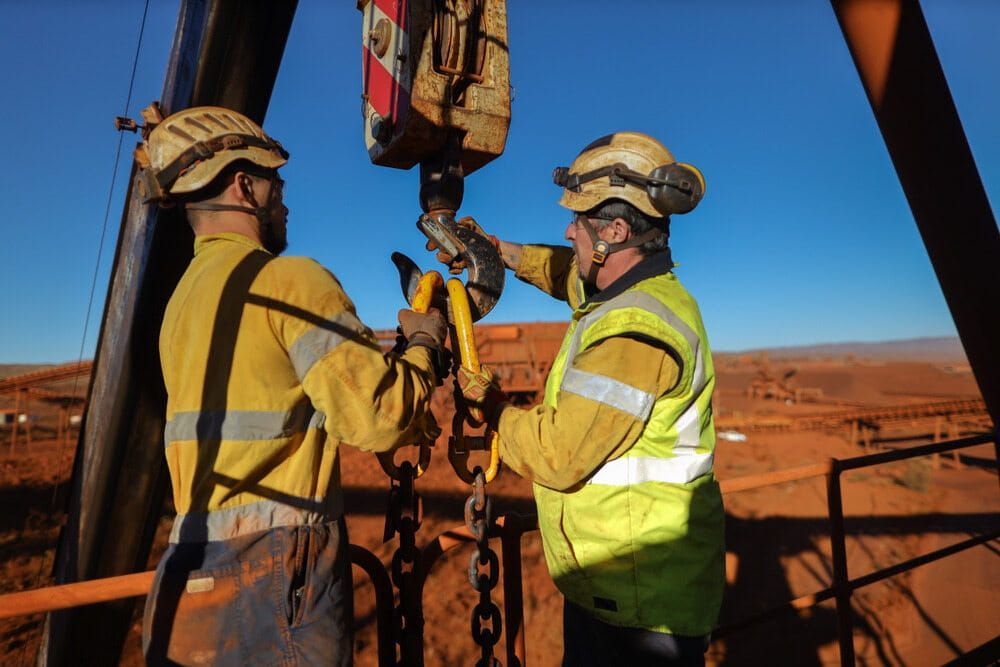 Two Men Are Working on a Crane in the Desert — Calibre Resourcing Solutions in Mackay, QLD