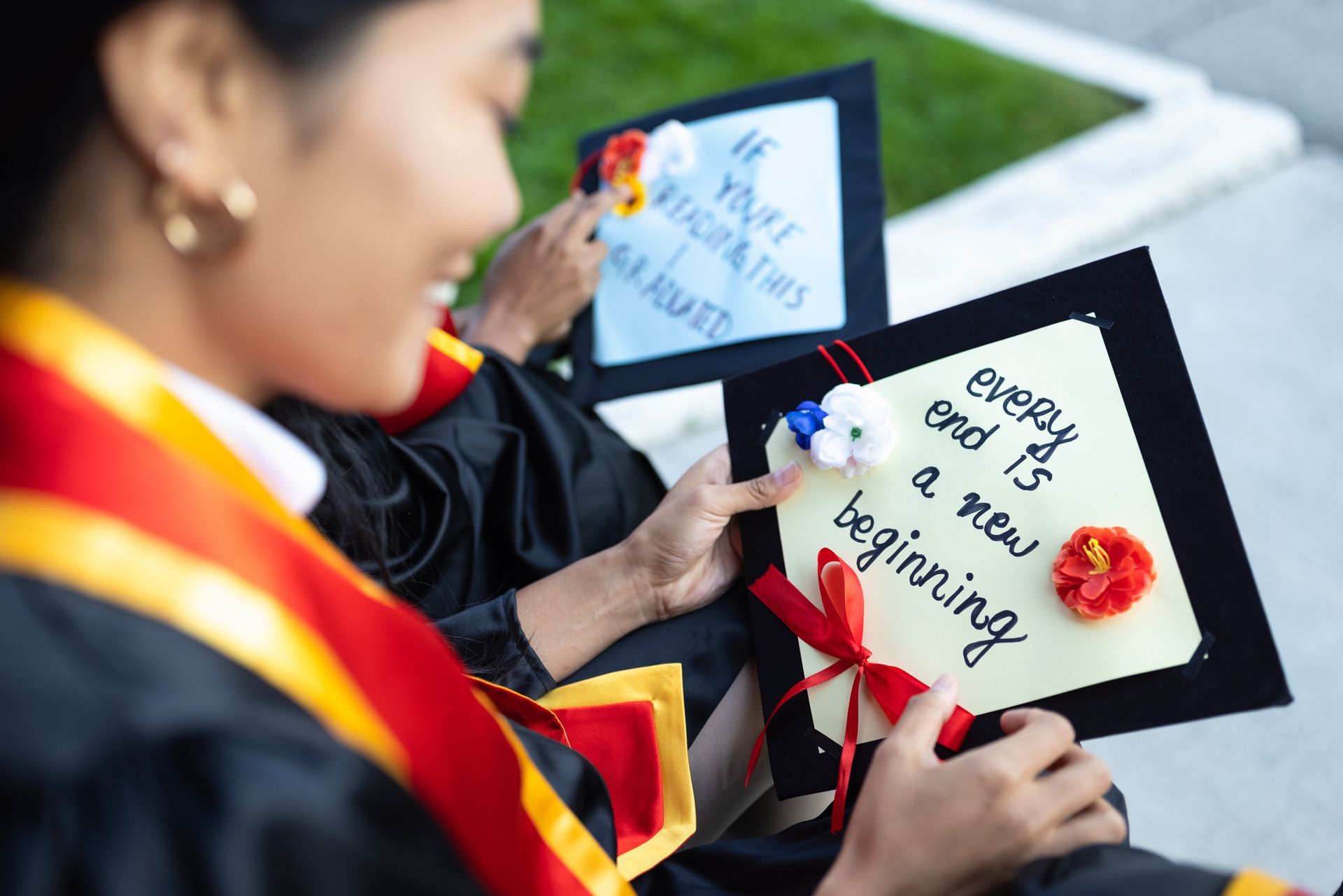 University students with their personalized mortarboards.