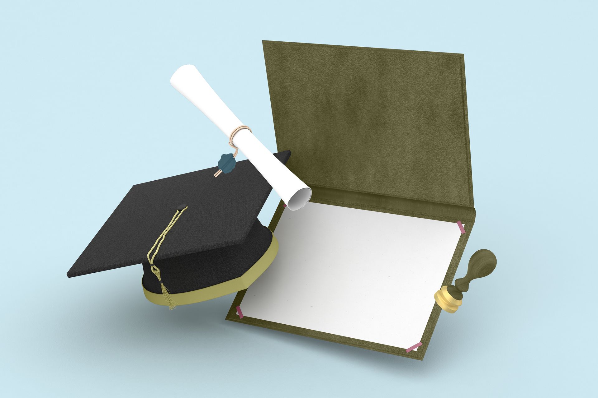 Mortarboard with diploma next to blank invitation.