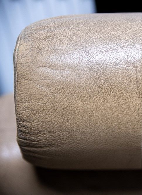 Car interior before valet service, showing a dirty and unhygienic seat cushion.
