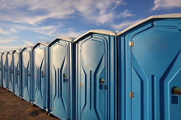 A Line of Several Portable Toilets — Roxboro, NC — Premium Tanks & Stone
