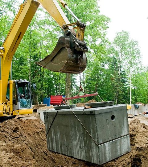 Installing Septic Tank with Excavator — Roxboro, NC — Premium Tanks & Stone