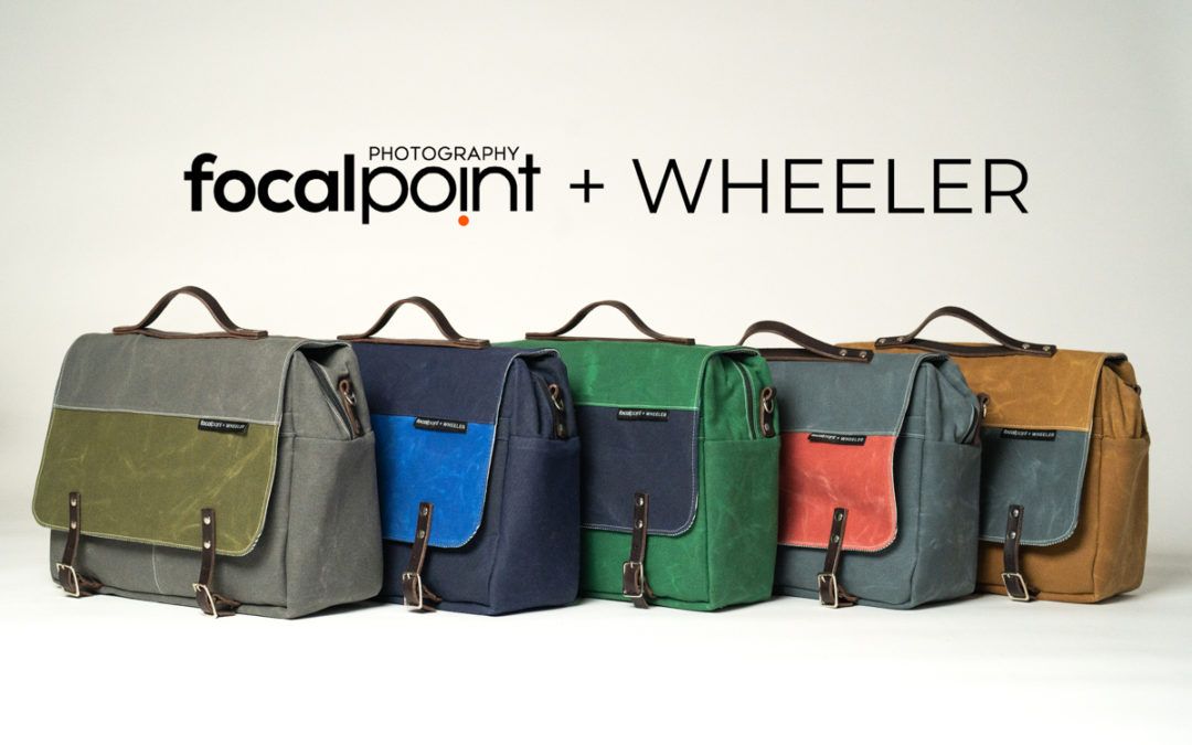 A row of focalpoint wheeler bags are lined up in a row