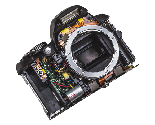 The inside of a camera is shown with the lens removed.