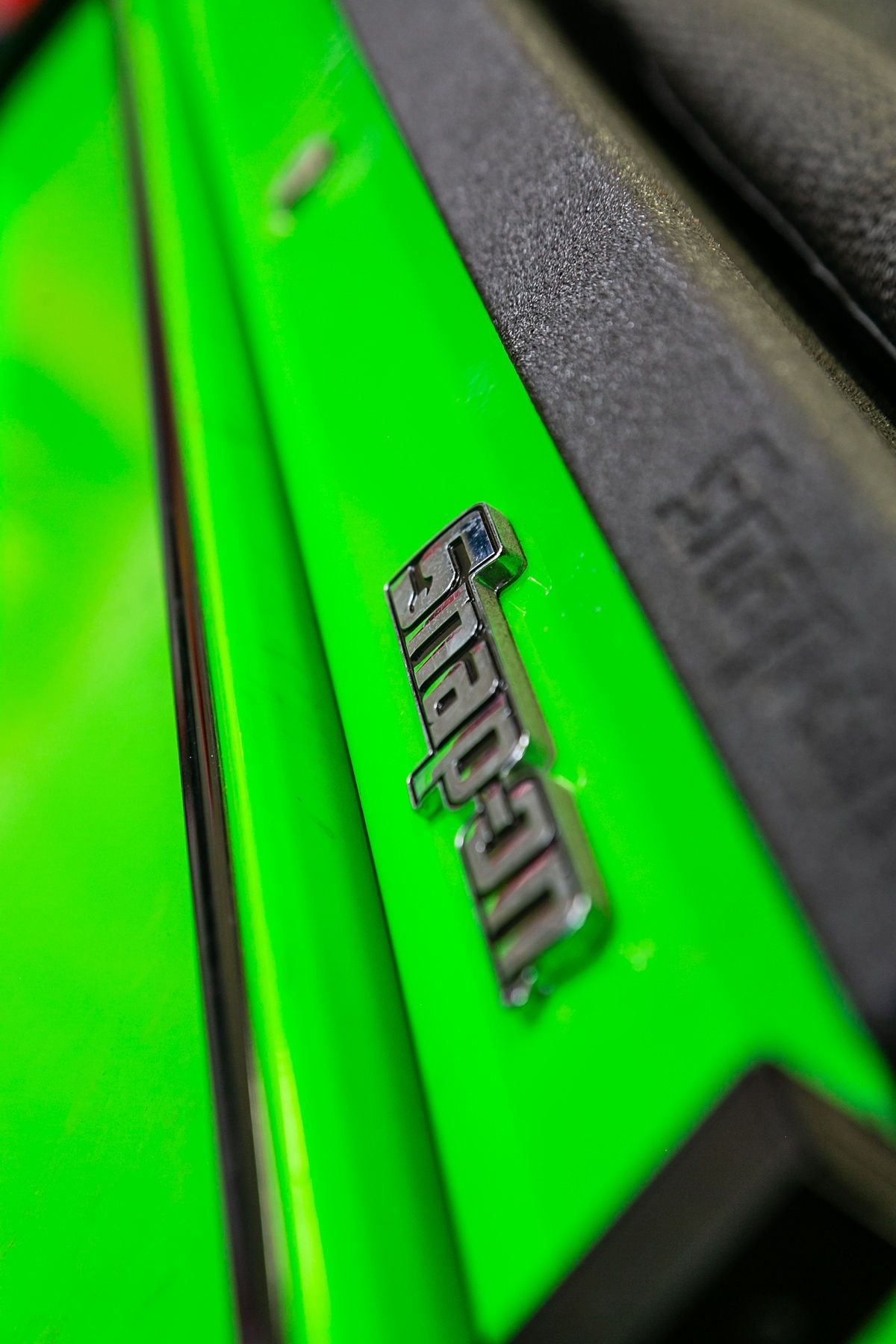 A bright neon green Snap-on tool chest with a metallic logo badge in focus. | 2 QuickAuto, Car & Tire Repair | Copperfield