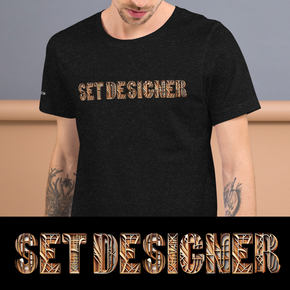 A man wearing a black t-shirt that says set designer