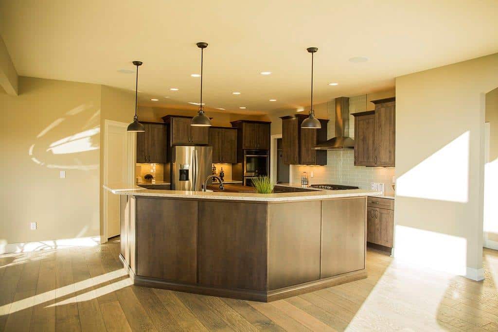 Kitchen With Hanging Lights & Island by Hansman Custom Homes in Mid-Missouri