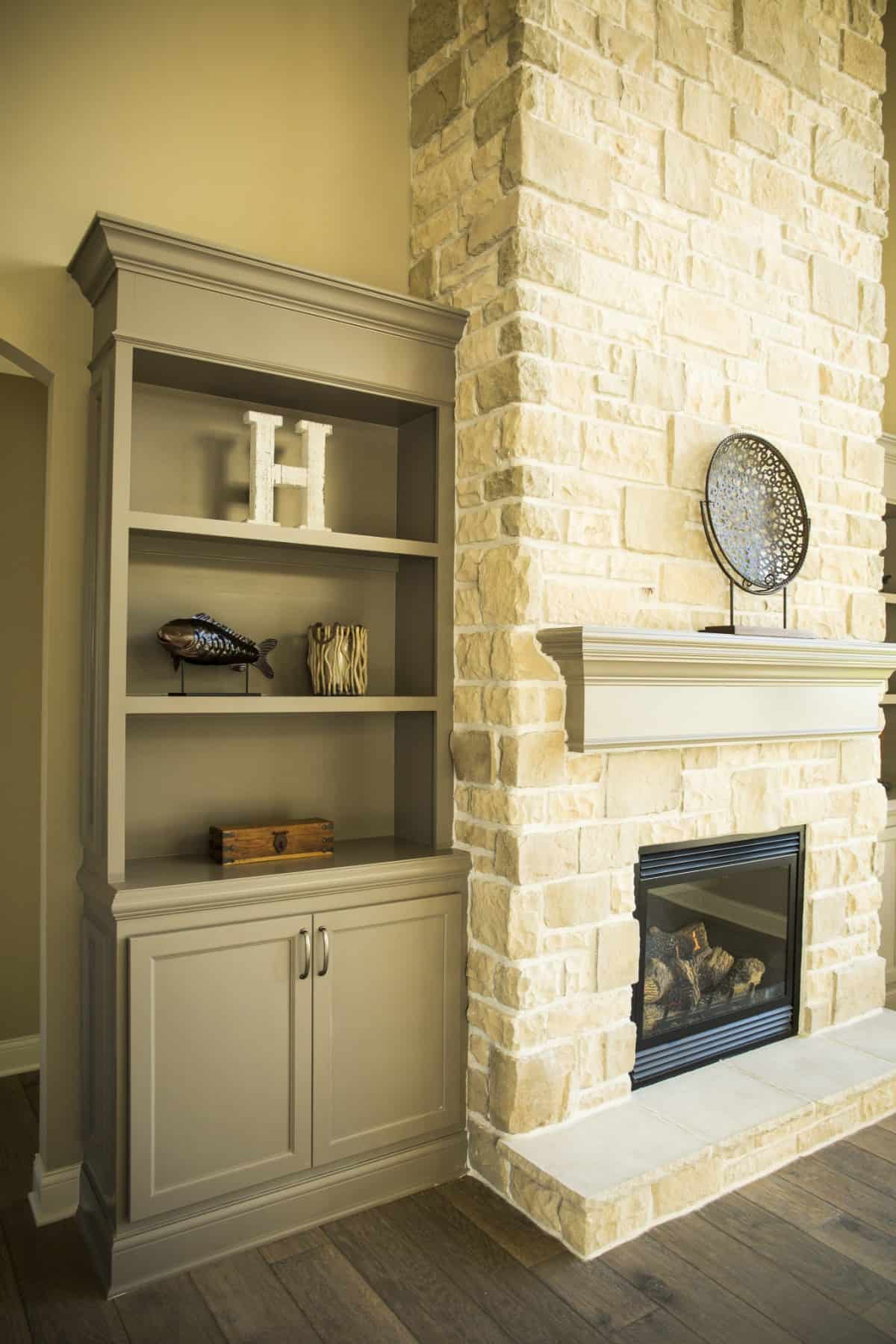Decorated Shelves & Custom Fireplace by Hansman Custom Homes in Mid-Missouri