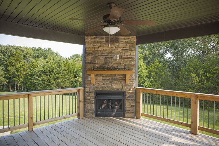 Outdoor Fireplace on Balcony by Hansman Custom Homes in Mid-MO
