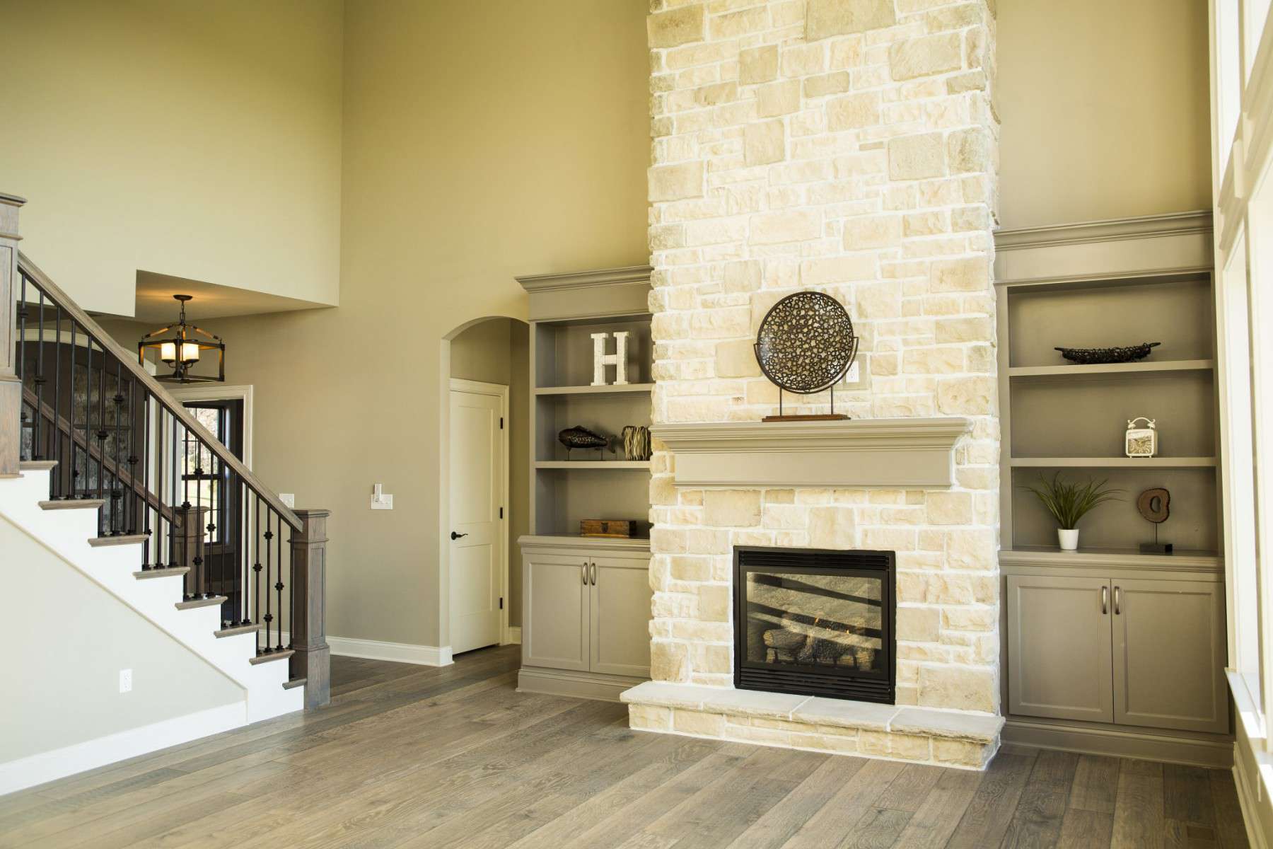 Decorated Shelves & Fireplace by Hansman Custom Homes in Mid-Missouri