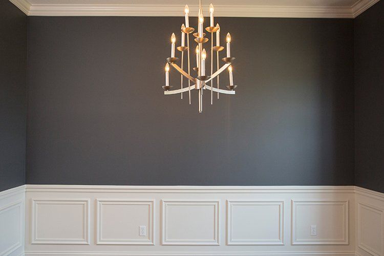 Room With Chandelier, Black Walls & White Lining by Hansman Custom Homes in Mid-MO