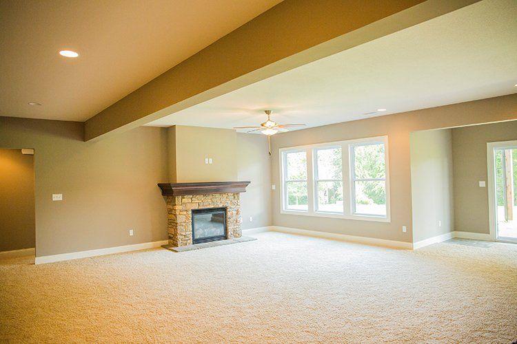 Large Low Ceiling Room With Fireplace by Hansman Custom Homes in Mid-MO