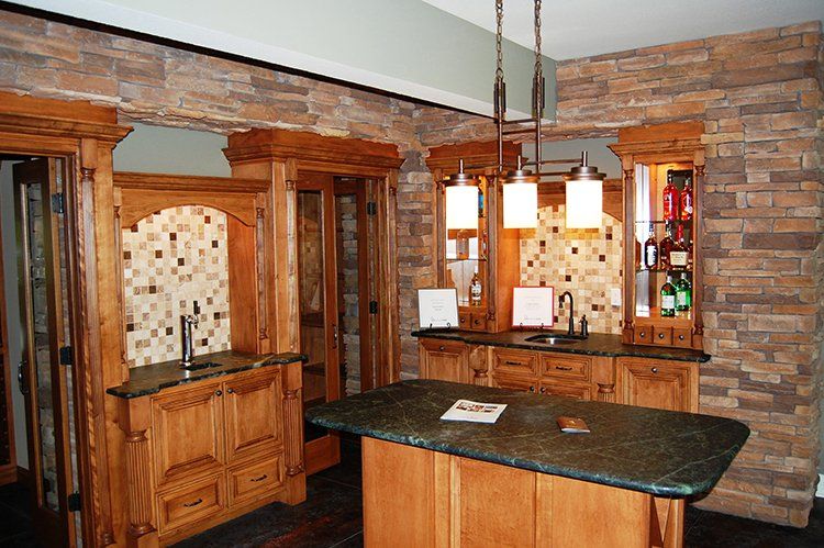 Custom Wet Bar With Hanging Lights by Hansman Custom Homes in Mid-MO
