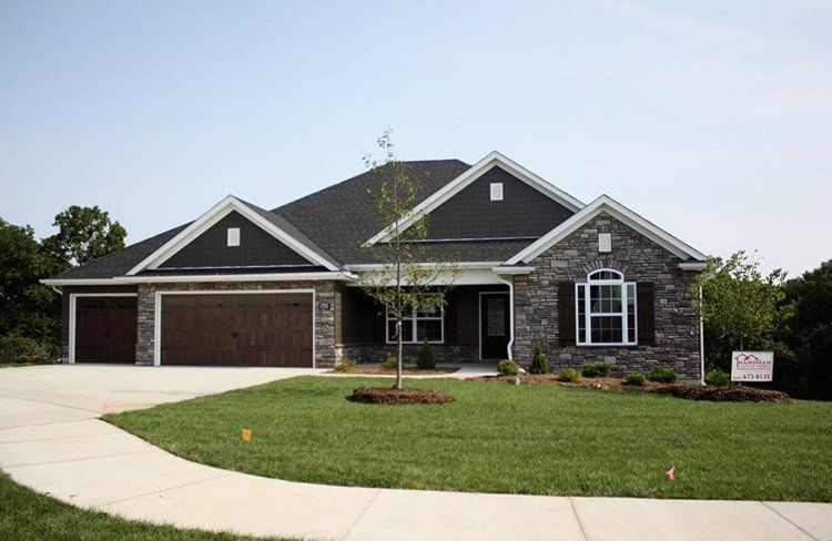Gray Home With White Siding by Hansman Custom Homes in Mid-MO