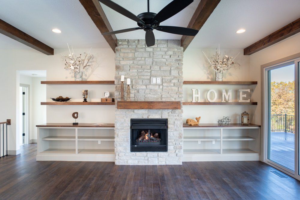 Centerpiece Fireplace & Shelves Designed by Hansman Custom Homes in Mid-MO