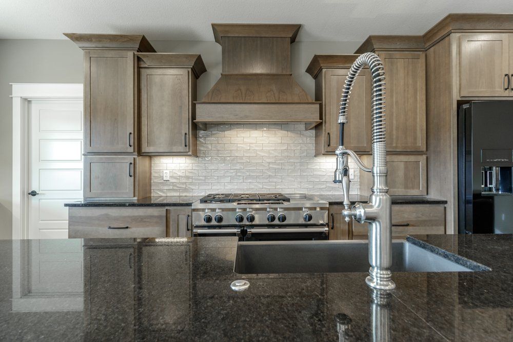 Kitchen Sink in Front of Oven Set by Hansman Custom Homes in Mid-Missouri