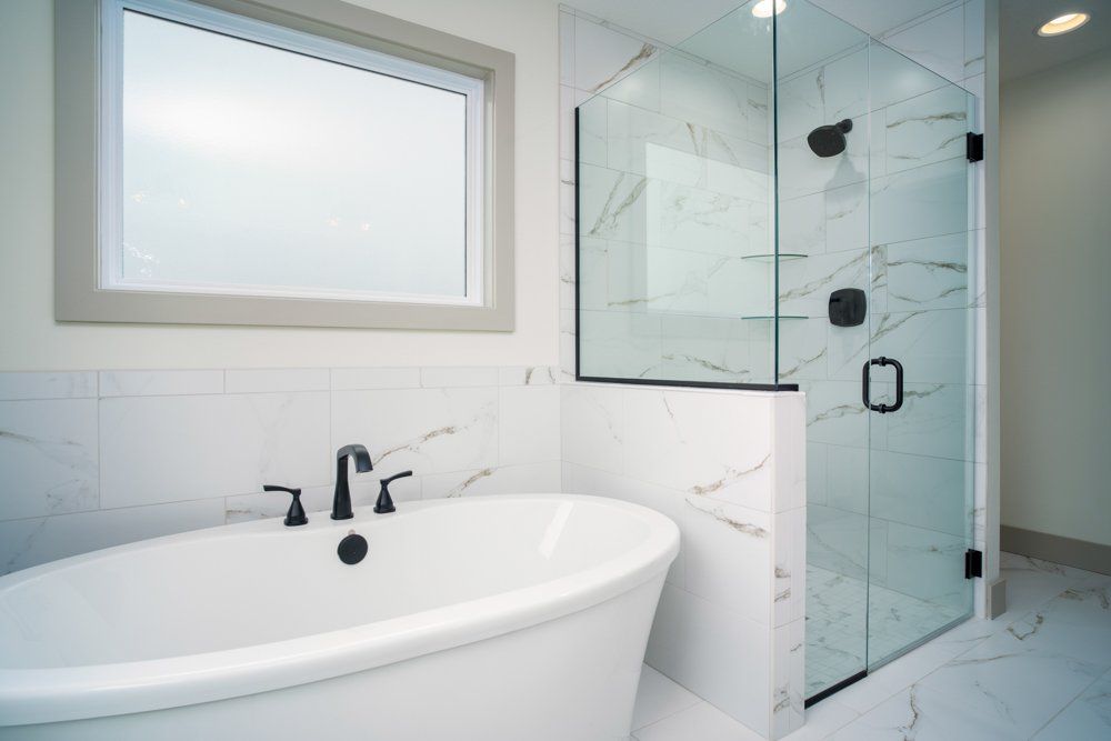 Master Bathroom With Bathtub & Walk-in Shower in Mid-MO by Hansman Custom Homes