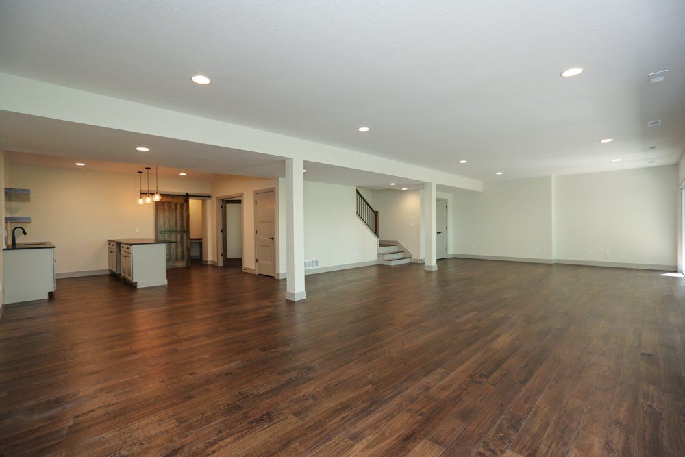 Hardwood Floor Basement by Hansman Custom Homes in Mid-MO