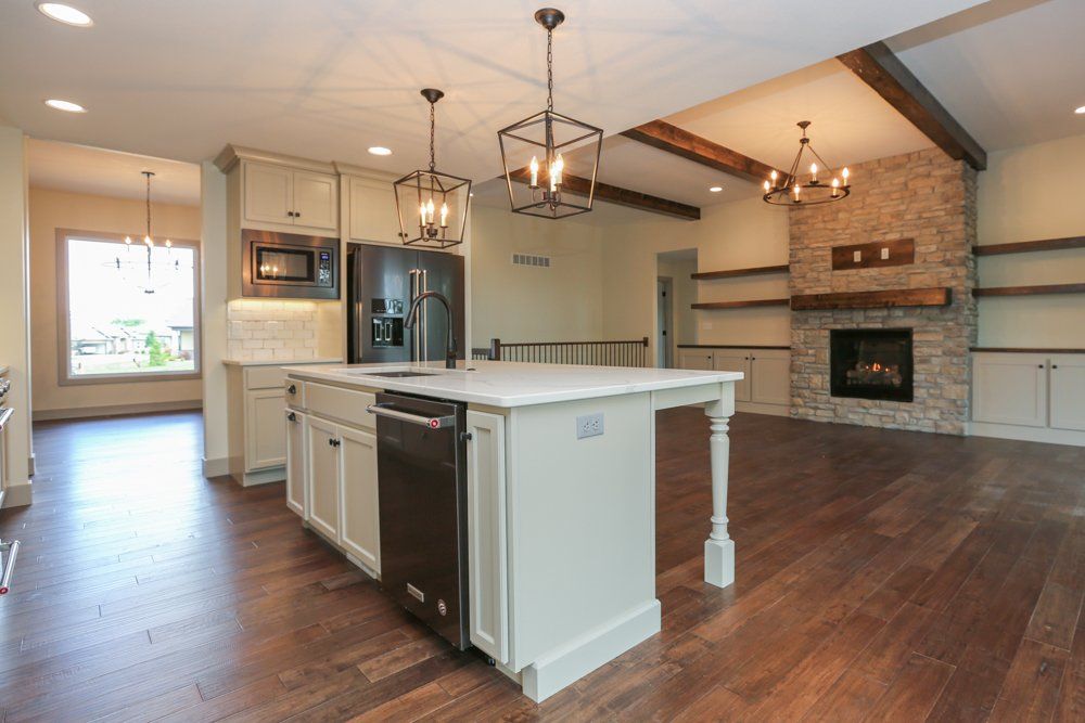 Big Kitchen With Fireplace Behind by Hansman Custom Homes in Mid-Missouri
