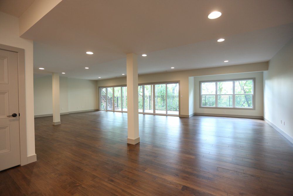Spacious Room With Pillars & Hardwood Floors by Hansman Custom Homes in Mid-Missouri