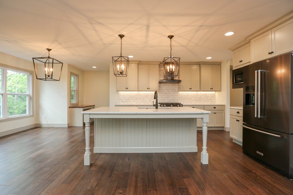 Open, Southern-Inspired Kitchen by Hansman Custom Homes in Mid-Missouri
