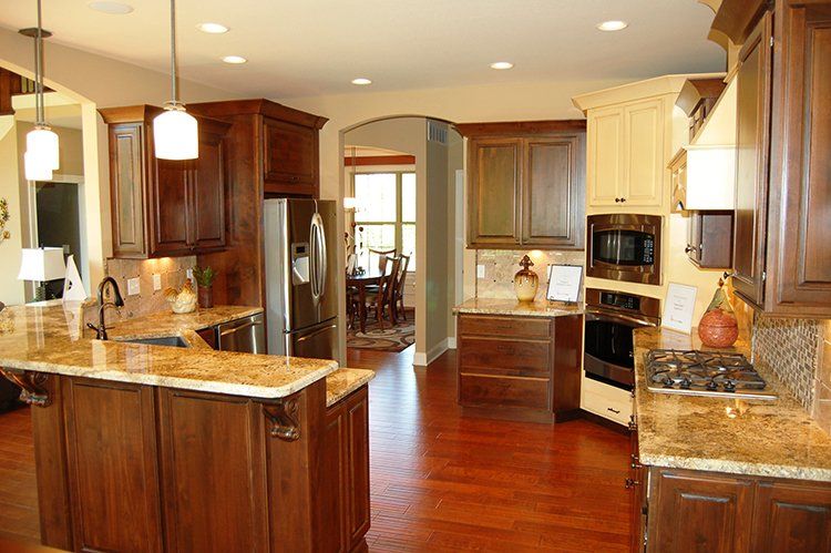 Warm-toned Softly Lit Kitchen by Hansman Custom Homes in Mid-Missouri