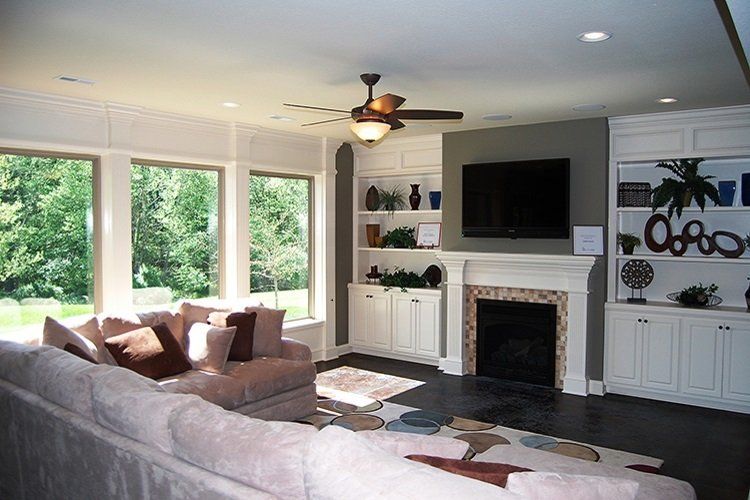 Spacious Living Room With TV by Hansman Custom Homes in Mid-MO