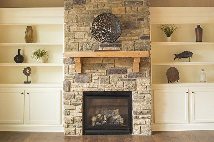Cozy Living Room Fireplace by Hansman Custom Homes in Mid-MO